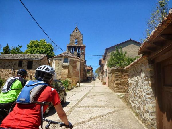 cycling through an old village on the way of St. James