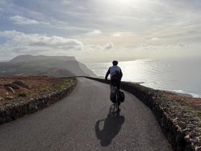 Cyclist riding along the coastal road