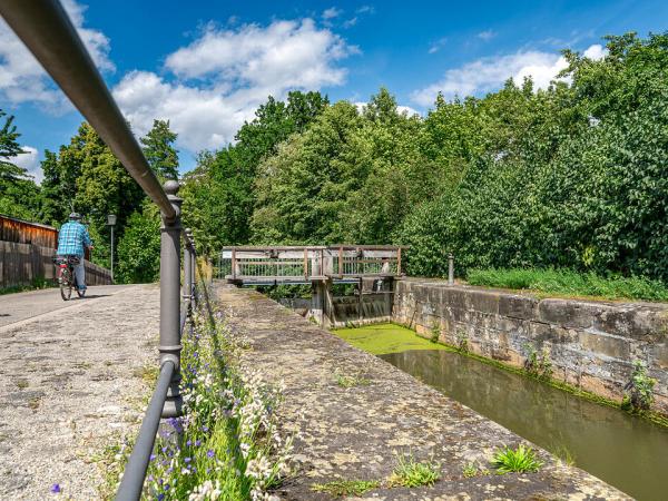 Cyclist at canal lock in Bamberg