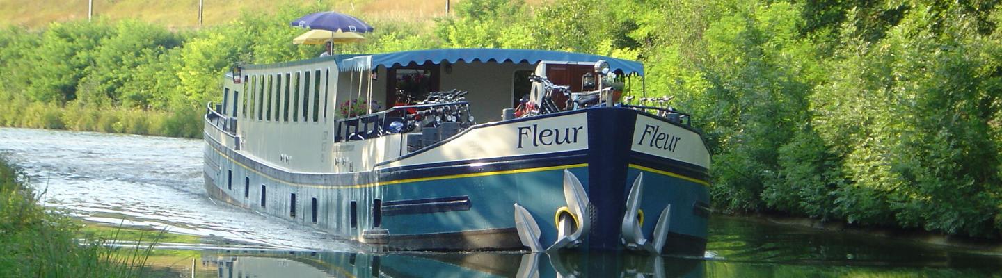 Fleur driving along a river