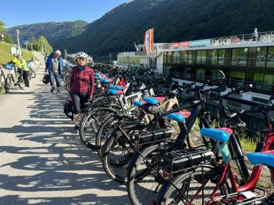 Bicycles lined up in front of the vessel with cyclists waiting to start their day