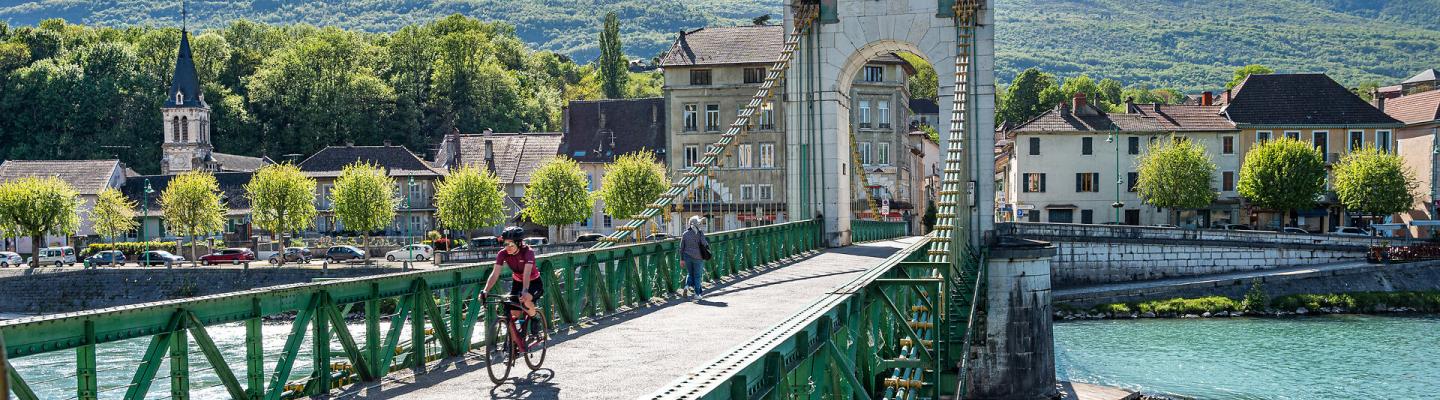 Cyclist on the Bridge in Seyssel | &copy; T. Garcia