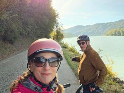 Happy cyclists stopping at sunshine along the river