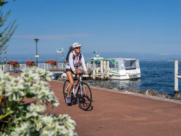 Cyclist on lake Genva in Evian-les-Bains