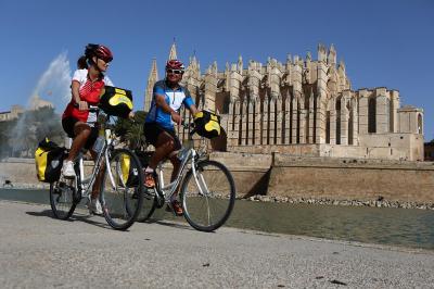 Cyclists in front of Palma Cathedral