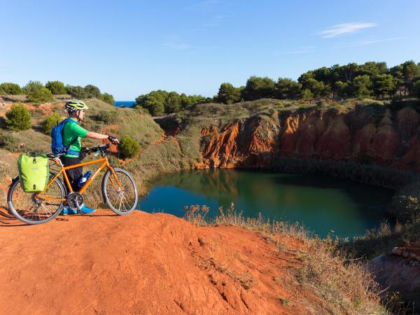 Cyclist in red sand