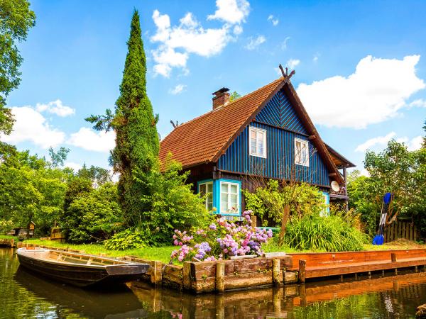 Wooden house with boats