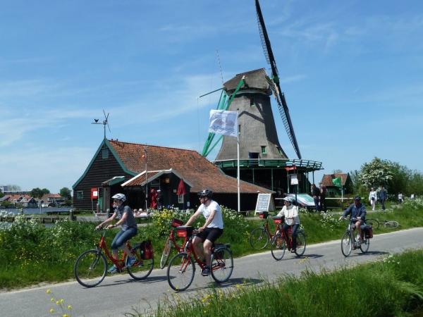 cyclists near windmill
