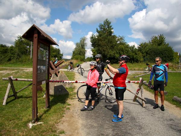 Cyclists reading an info sign